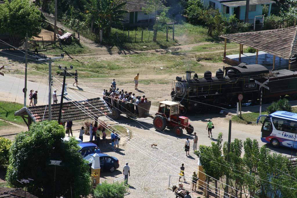 Local transport crossing in front of the train at Valle de los Ingenios, near Trinidad.