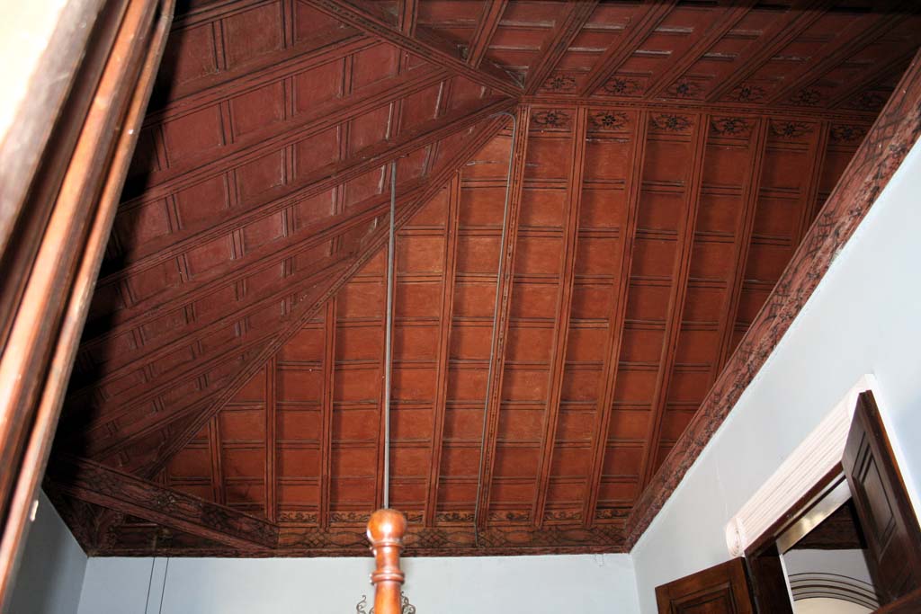The ceiling in an upper room.