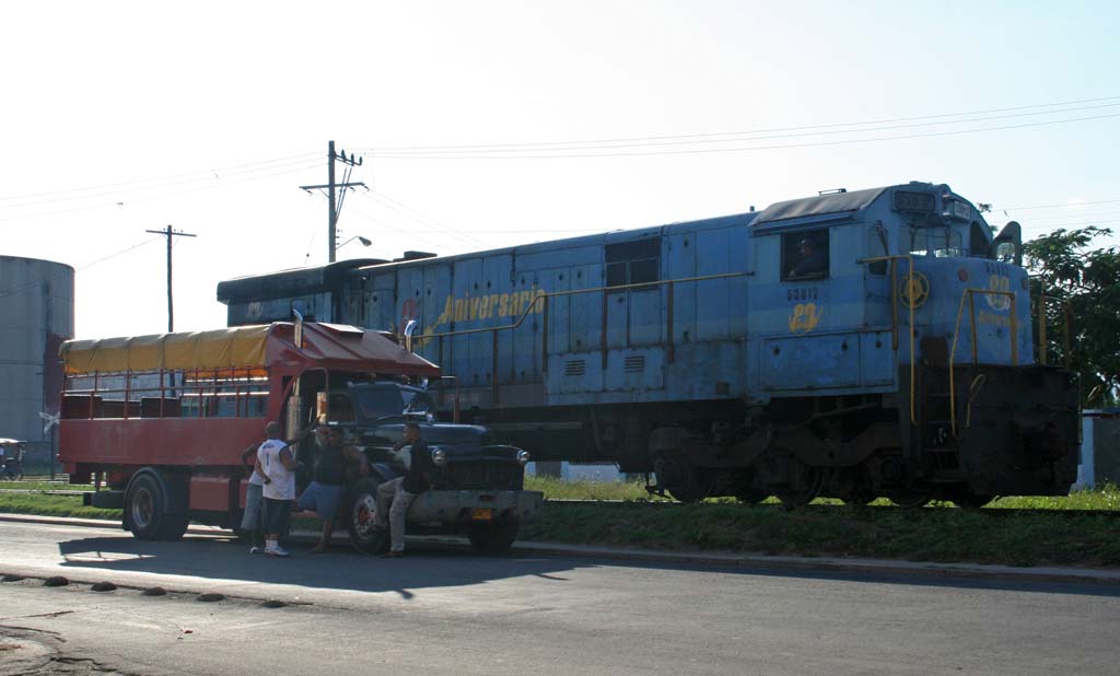 A passenger truck by the railway.
