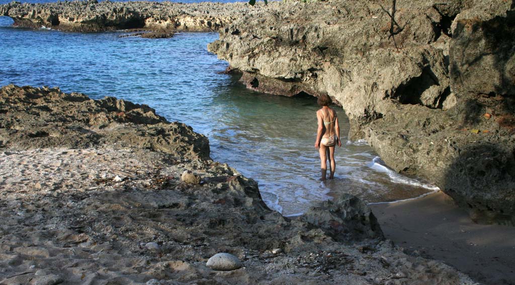 Mary taking to the water from the tiny <em>Playa Blanca,</em> between the rocks in the bottom right hand corner of the photo.