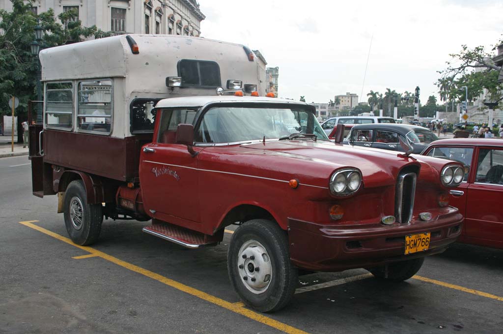 Is it a car? Is it a truck? The front part, at least, is an Edsel, parked outside <em>El Capitolio.</em>