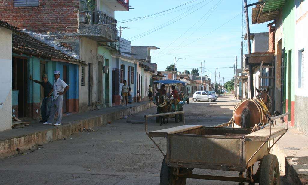 At the bottom end of town, away from the cobbles.