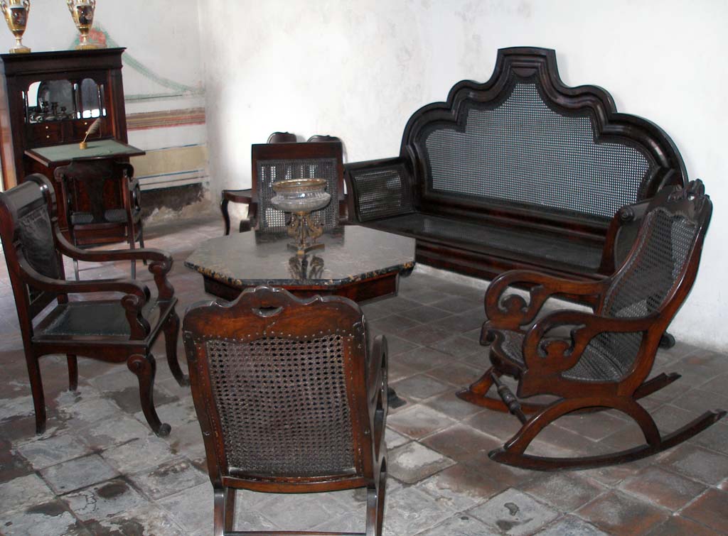 Chairs - two of them rockers, sofa and table.