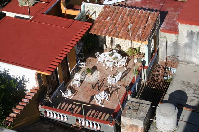 Looking down onto someone's patio in the sunshine.