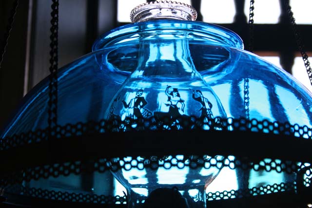 Dancers etched on the chimney of a lamp in the <em>Museo Romántico.</em>