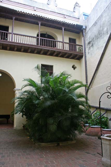 The courtyard - note the <em>tinajones</em> sunken into the patio.