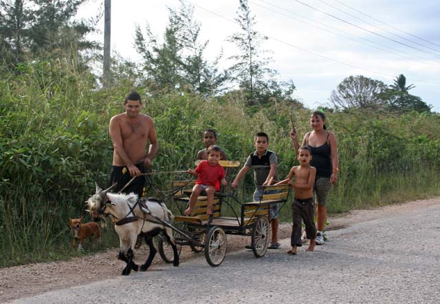 A family with their goat cart on the road near Camagüey.