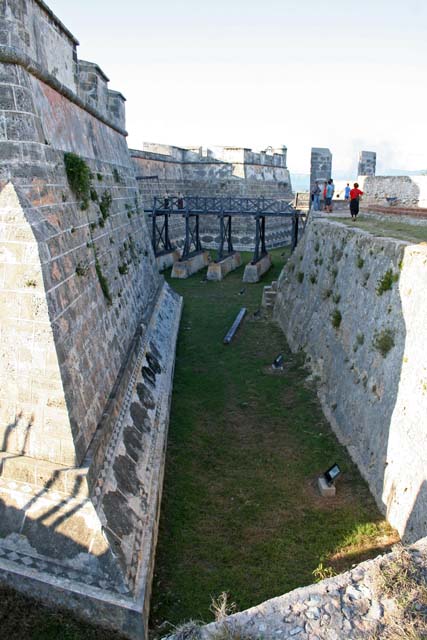 The moat of <em>El Castillo del Morro</em> outside Santiago.