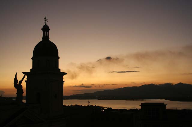 Santiago's cathedral tower in silhouette from the roof terrace of <em>Hotel Casa Granda.</em>