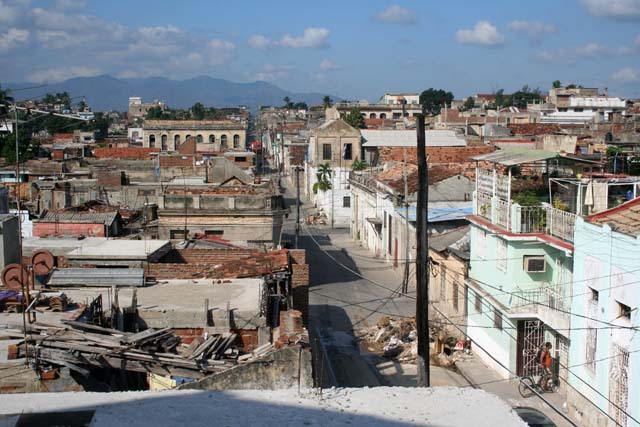 The street by day - there are piles of rubble every couple of blocks or so.