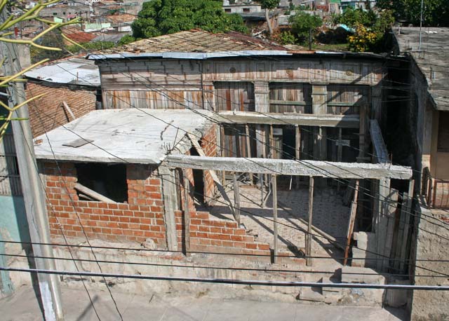 A closer view of the neighbours' house across the street.