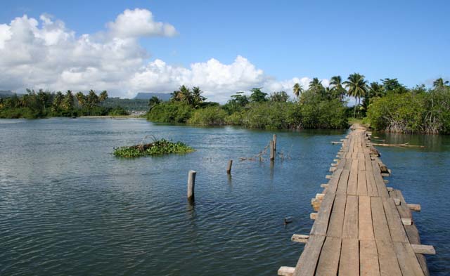 The long wooden causeway leading to the village.
