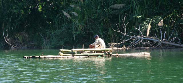 A fisherman (we assume) on the River Toa.