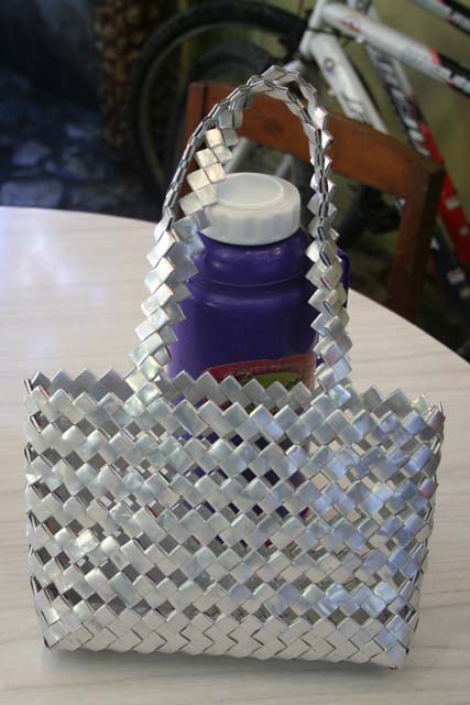 A handbag made by a local 86-year-old from... plastic toothpaste tubes, which are silvery on the inside.