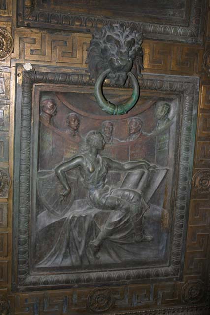 A bronze door decoration.