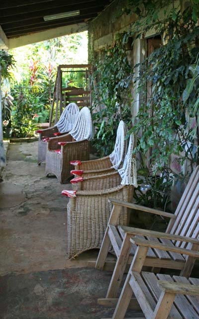 The veranda, with wicker chairs and rockers.
