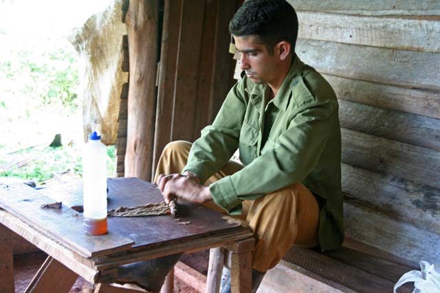 Another cigar being rolled.