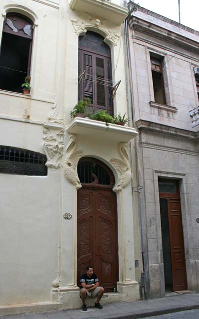 Art nouveau doorway with bird decorations.