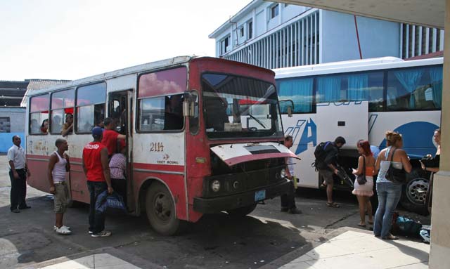 A bus used by the locals (our spiffy Viazul bus is next to it) at Cienfuegos bus station. We assume the bonnet's open to let the engine cool (we saw a lot of this).