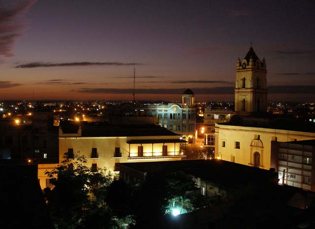 Camagüey at night from the roof terrace of the <em>Gran Hotel,</em> where we had a cocktail.