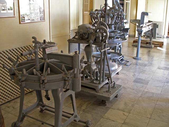 More machines used for producing rum. The nearest filters the rum through paper.