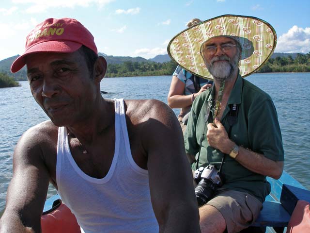 Chris in a folding Chinese hat on the River Toa, near Baracoa.