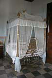 Fine four poster bed with mosquito nets.