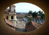 Through an oval porthole, halfway up the Museo de la Lucha Contra Bandidos bell tower, towards Plaza Mayor.