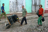 Arriving in Trinidad with our luggage being helpfully portered from the bus.