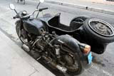 An ancient motorbike and sidecar.