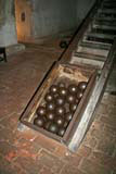 A box of cannonballs ready to go up to the cannons.