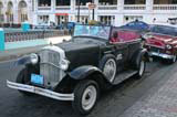 A Grancar classic in Santiago, with a Chevy parked behind.