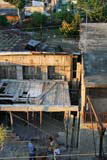 The neighbours added some roof timbers while we were there. Their garden is visible behind the house.