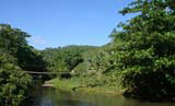A river, with bridge, seen from the bus.