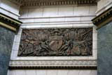 One of several bronze reliefs around the lobby.