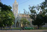 A Plymouth Savoy parked outside a newly restored church in Vedado, Havana.