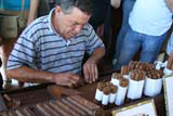Rolling the cigar.