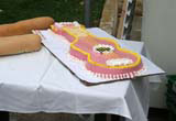 A pink iced guitar at a cake festival in Havana.