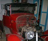 A vintage car under restoration in Ana Miriam's garage in Havana.