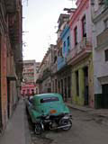This car model's identified only by the '8' - a Buick 8? There's something a bit later just visible further along this Havana street.
