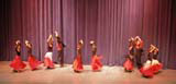 A display of dancing by students, some of them very young.