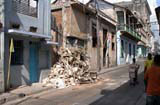 One of the many piles of rubble that make Santiago's residential streets look like a war zone.