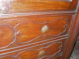 Decorated drawer panels.