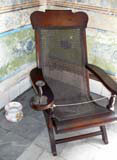 Pajilla smoking chair with built-in ashtray for the enjoyment of a fine cigar.