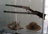 Weapons and a hat in the small museum display.