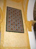 A tile decoration in the dining room.