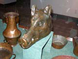 A copper boar's head container.