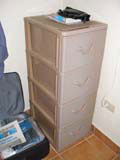 The slightly bizarre plastic filing cabinet-style chest of drawers in our room.