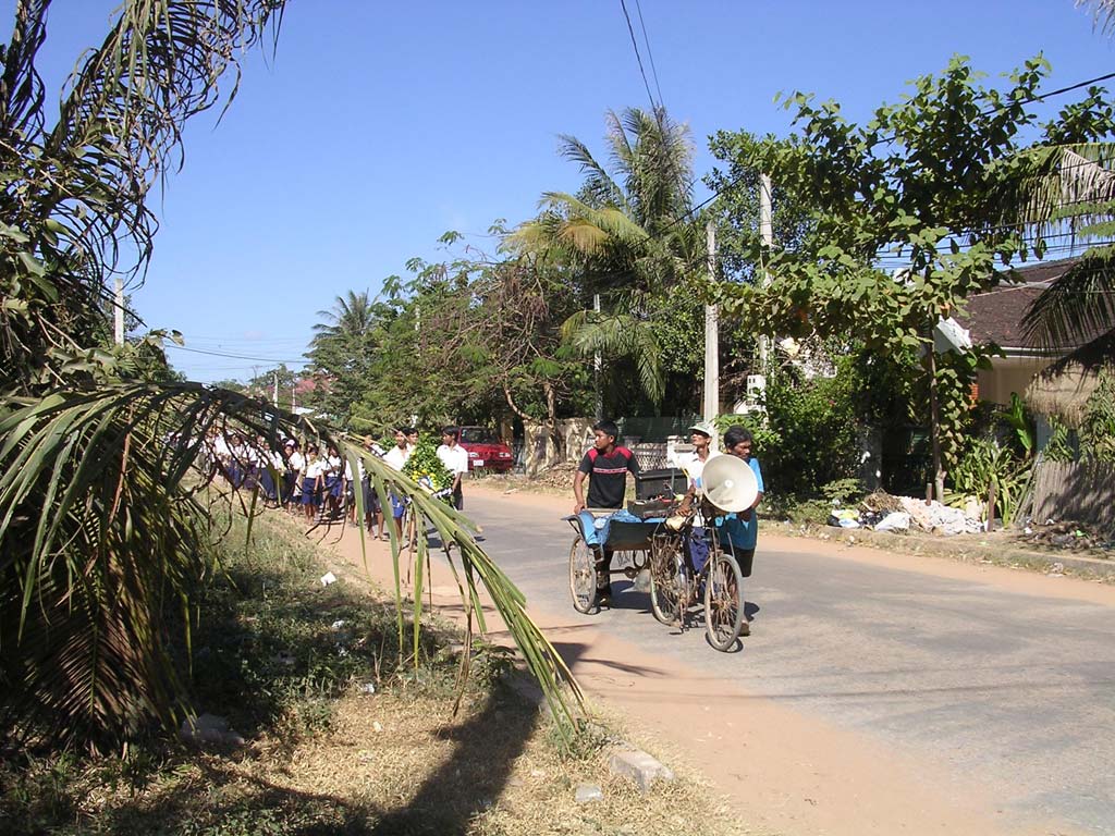 Funeral procession of children, with musical accompaniment