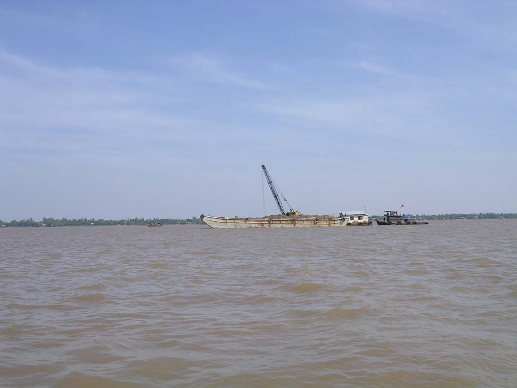 Our first sight in Vietnam: a dredger